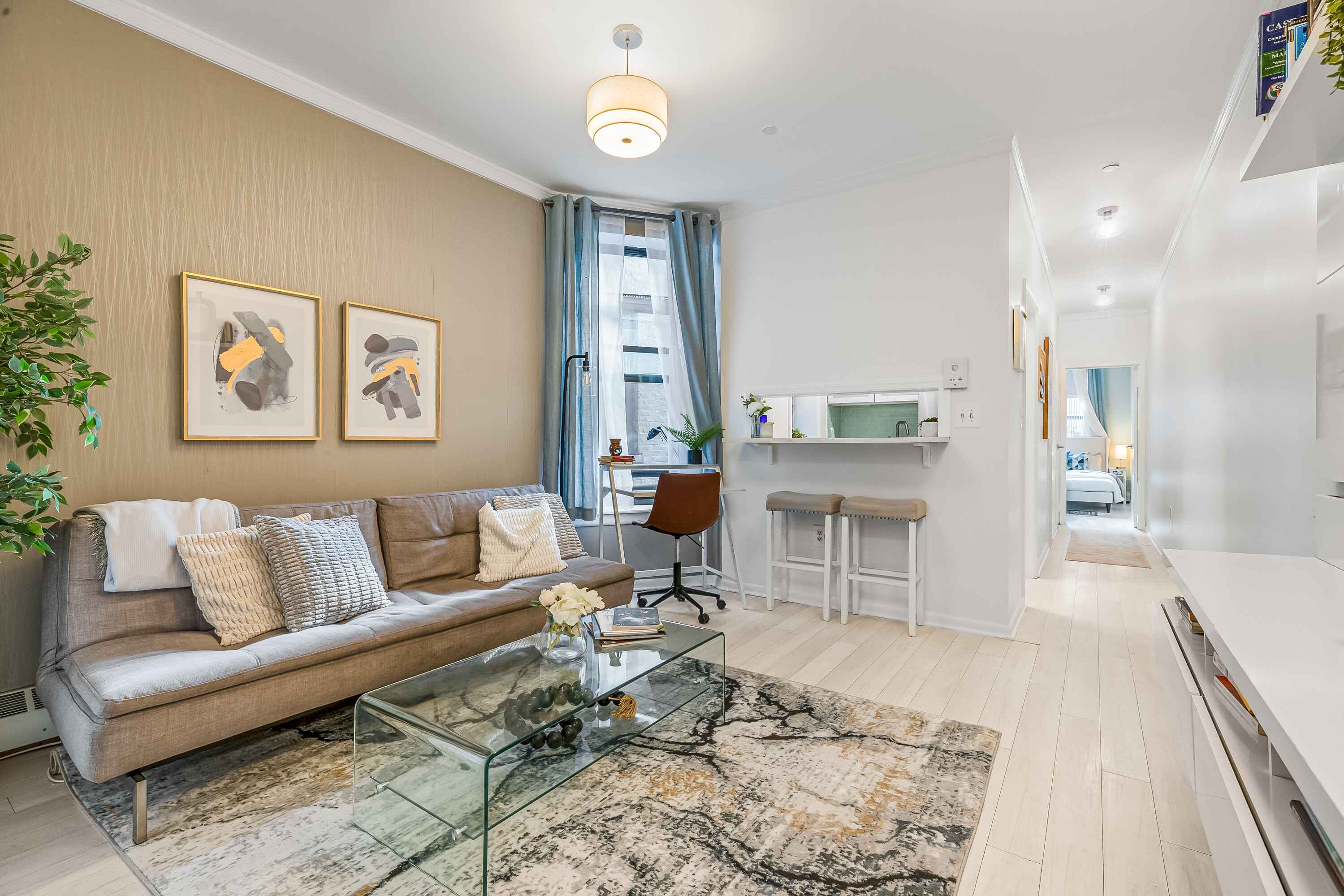 108 West 114th Street, Unit 4B Manhattan, NY 10026 - Photo 2 of 11 a living room with furniture and a large window