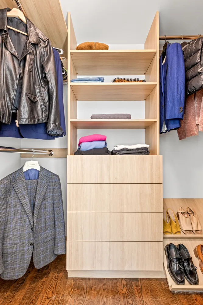 a utility room with clothes and shoes