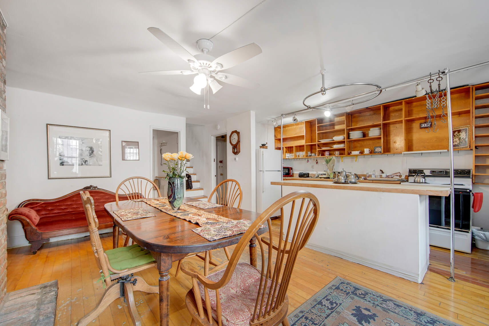 337 East 18th Street Manhattan, NY 10003 - Photo 6 of 16 a view of a dining room with furniture and wooden floor