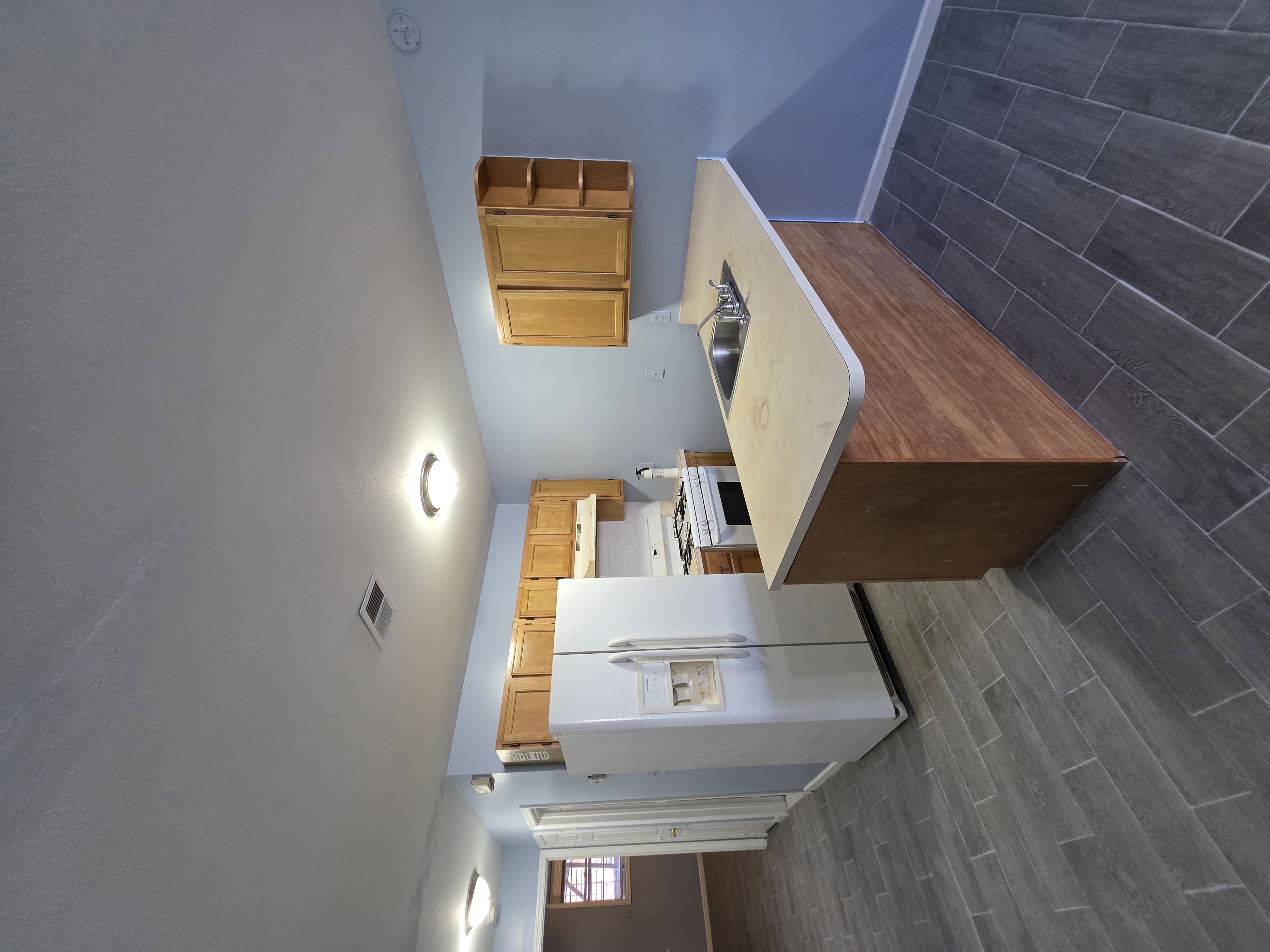 216 Pond Way, Unit 1 Staten Island, NY 10303 - Photo 5 of 9 a room with a bed and a large window