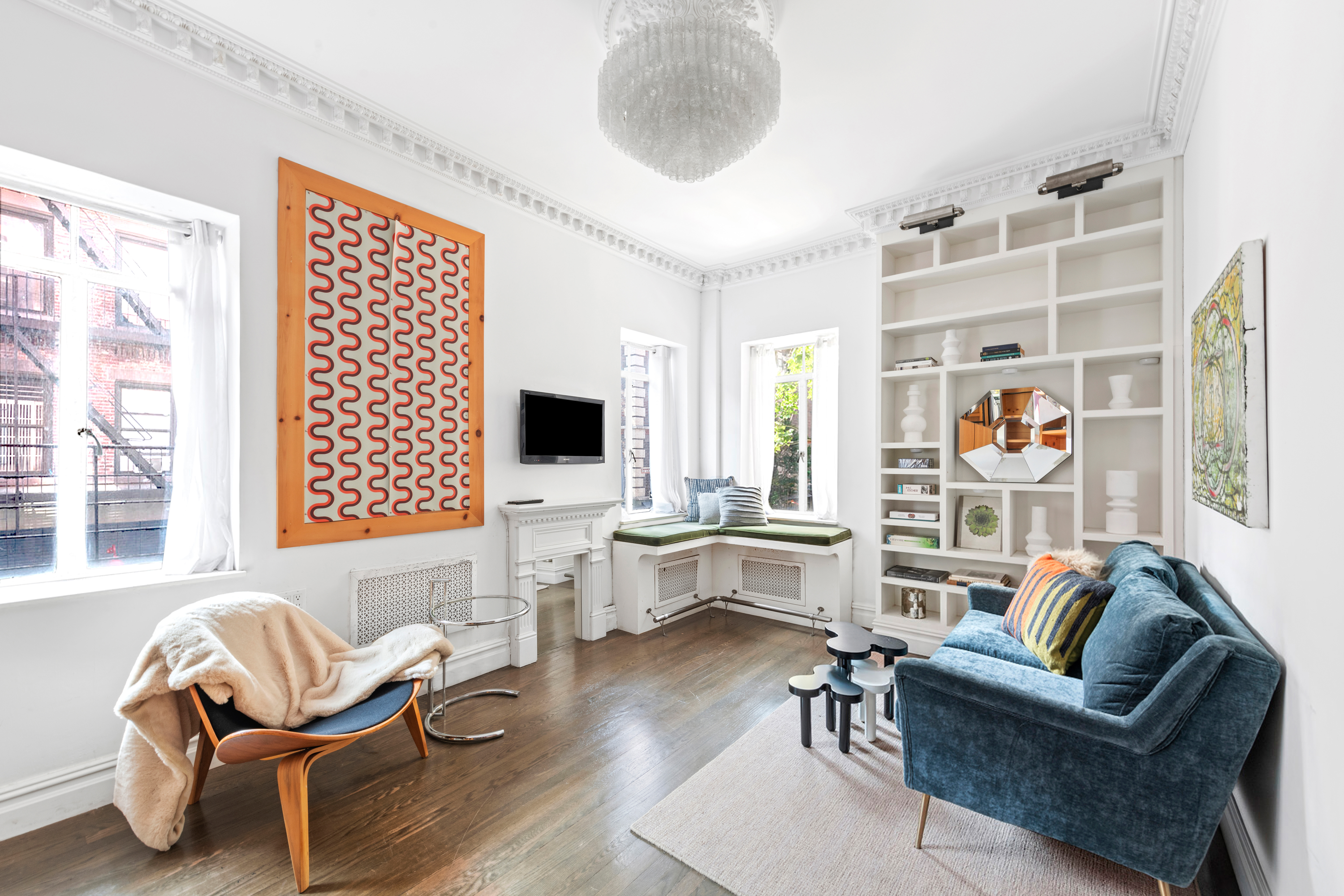 32 Downing Street, Unit 2D Manhattan, NY 10014 - Photo 2 of 9 a living room with furniture and a flat screen tv