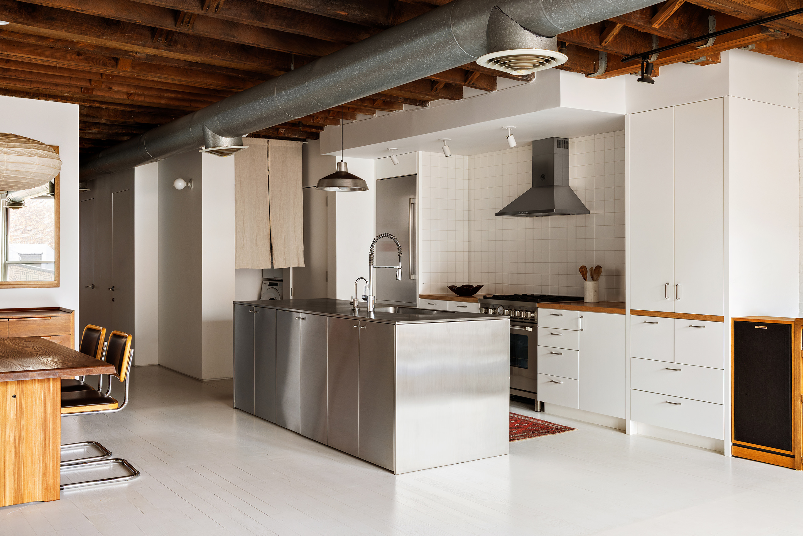 48 Canal Street, Unit 4 Manhattan, NY 10002 - Photo 4 of 13 a view of kitchen with refrigerator and white cabinets