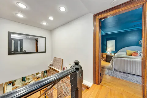 a bedroom with a bed and a couch