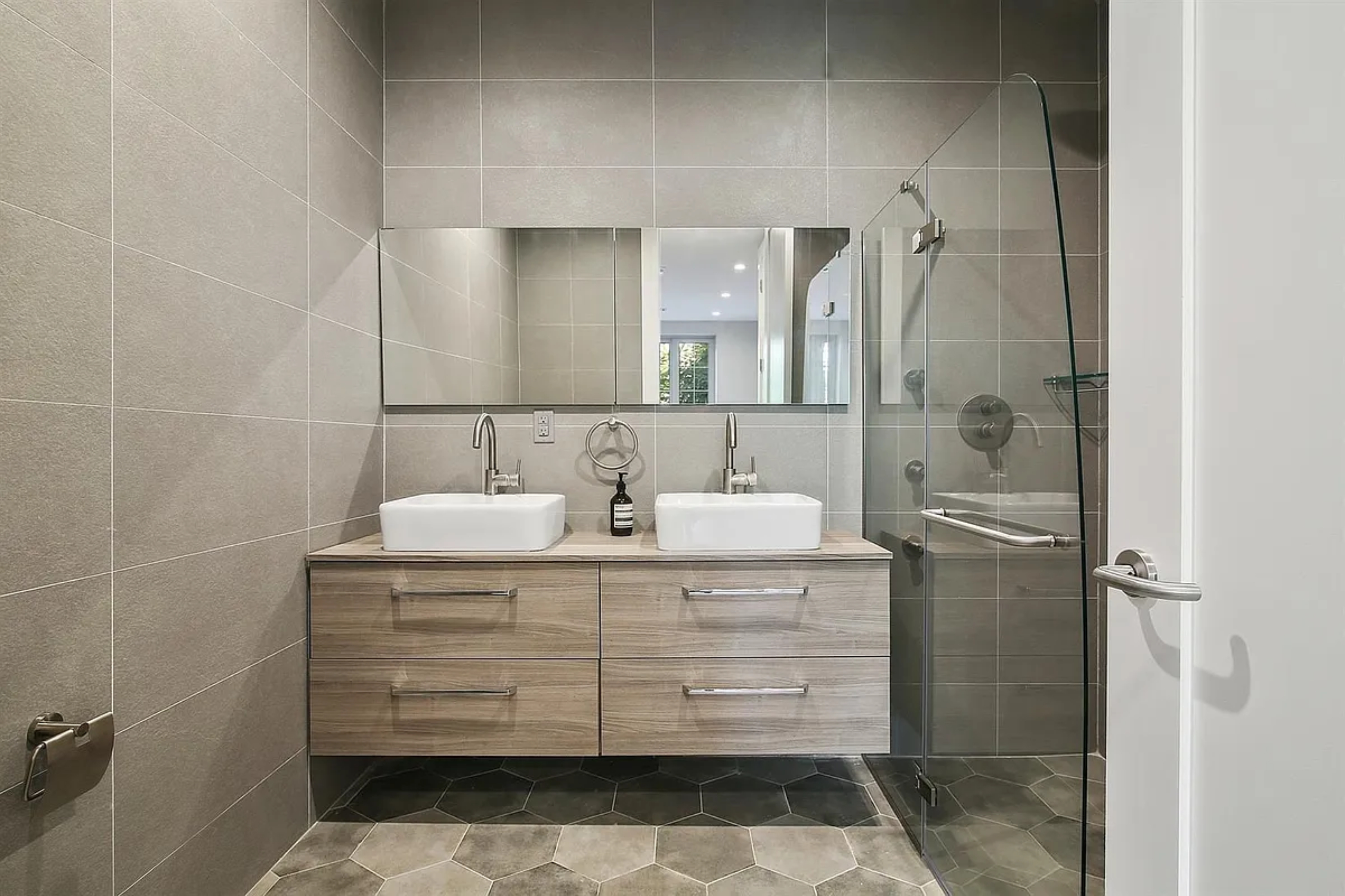 132 Cambridge Place, Unit 3 Brooklyn, NY 11238 - Photo 6 of 8 a bathroom with a sink toilet and shower