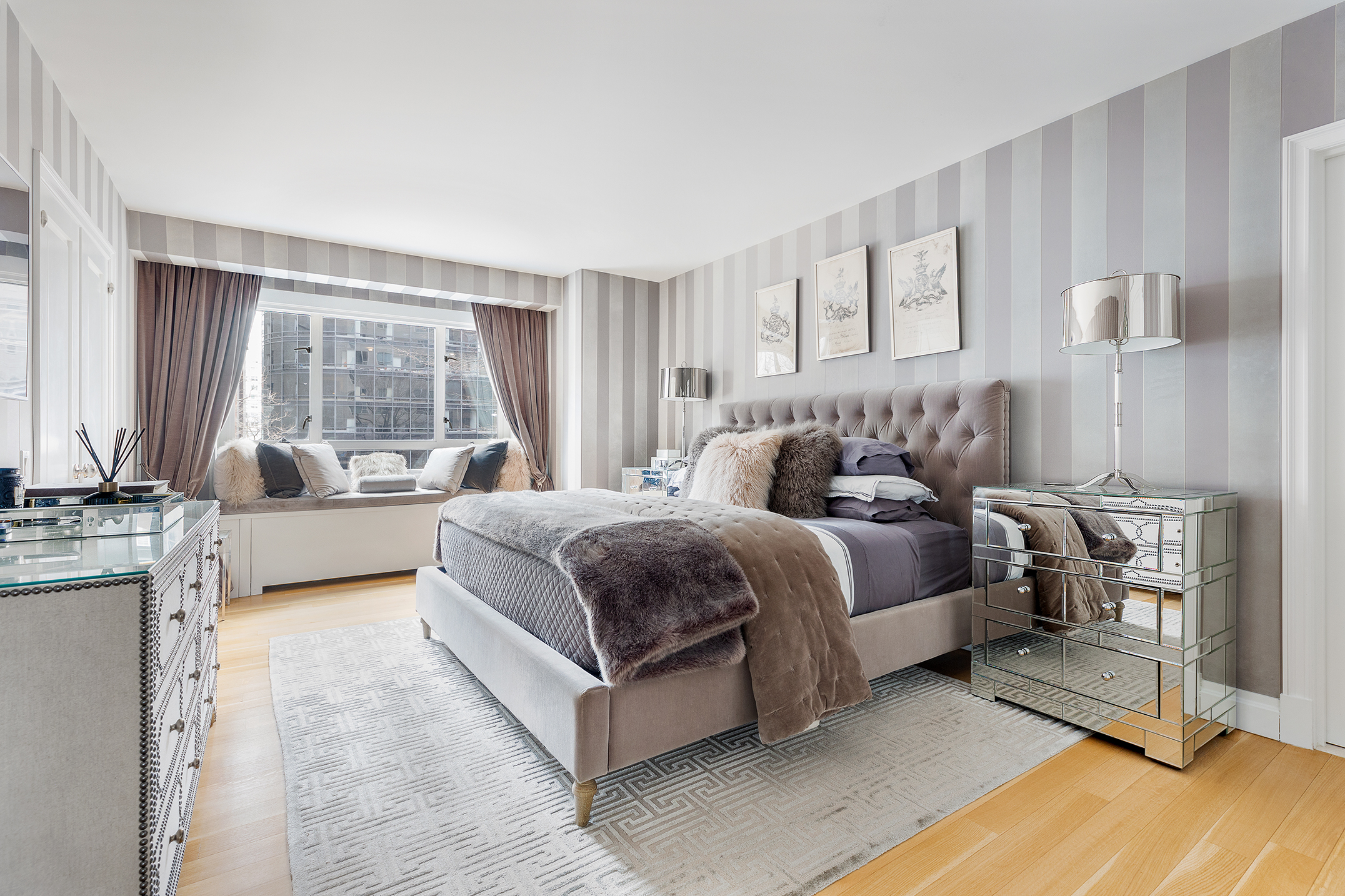 200 East 66th Street, Unit E207 Manhattan, NY 10065 - Photo 6 of 12 a spacious bedroom with a bed and a large window