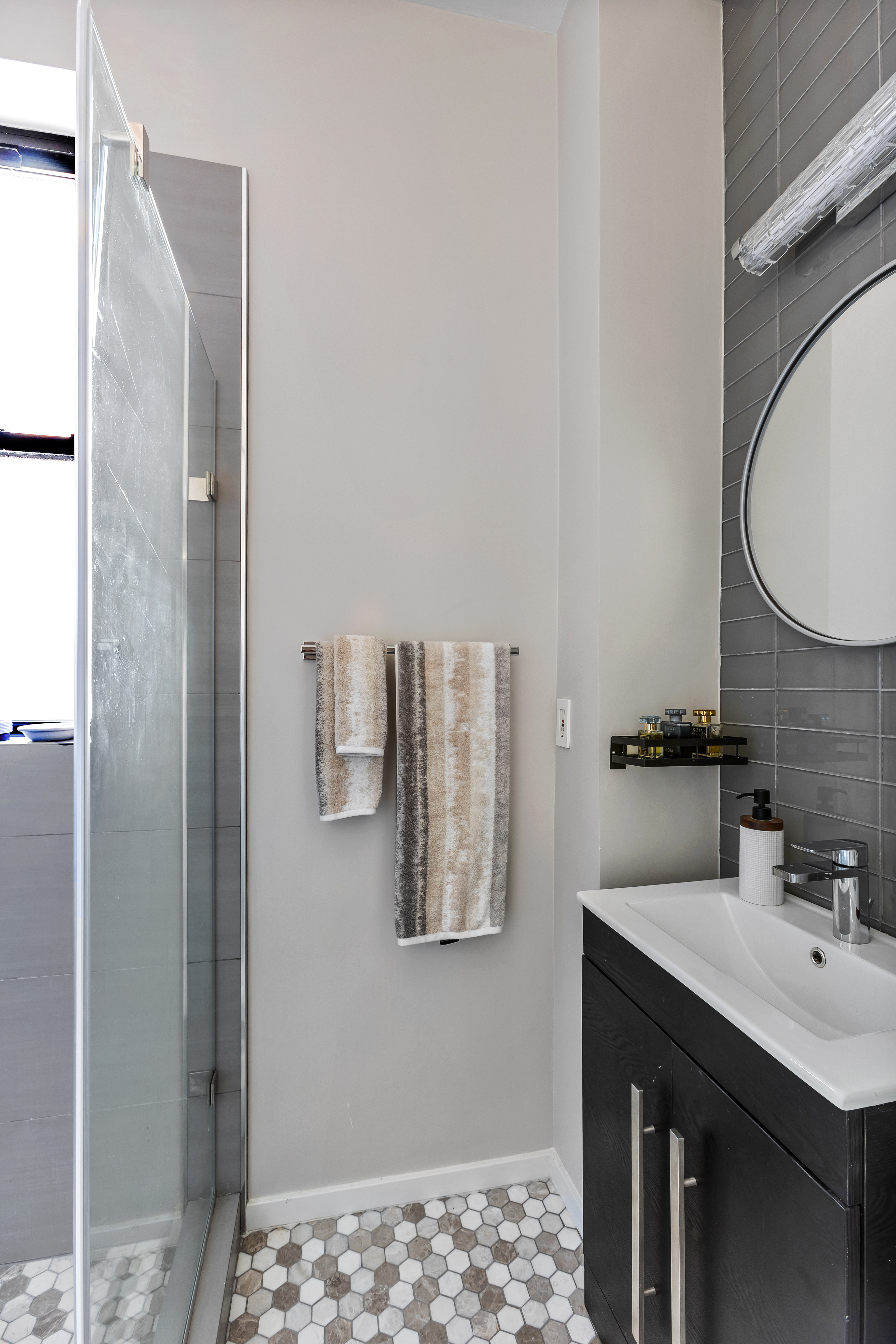 420 Riverside Drive, Unit 7K Manhattan, NY 10025 - Photo 5 of 7 a bathroom with a sink and a mirror