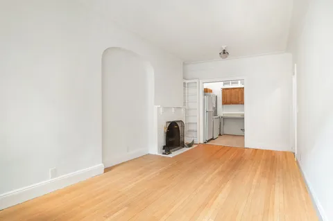 a bedroom with a bed and a table