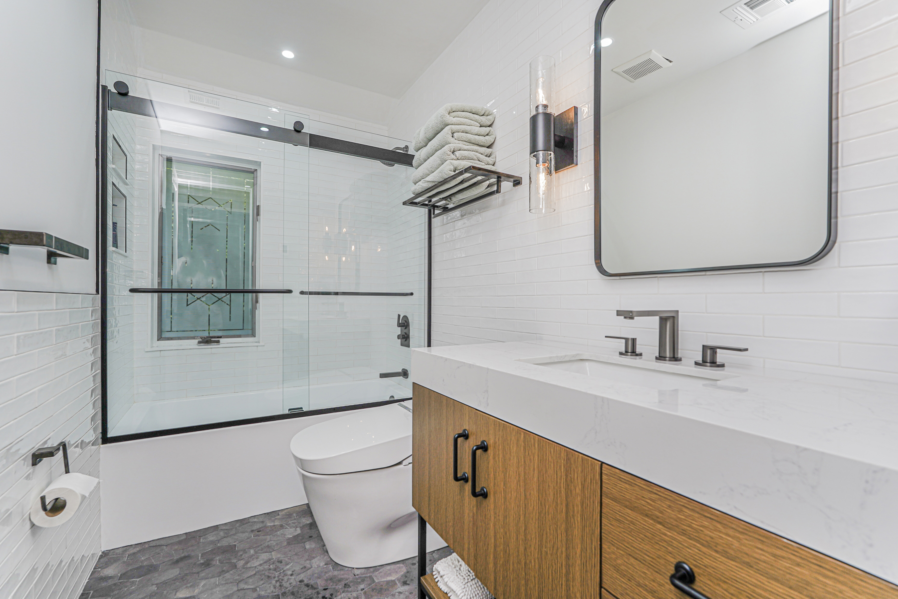 165 Swaim Avenue Staten Island, NY 10312 - Photo 18 of 45 a bathroom with a sink a toilet and shower