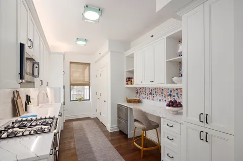 a bathroom with a sink mirror and a bathtub