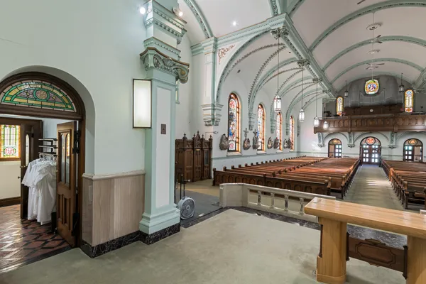 a room with furniture a rug and a window