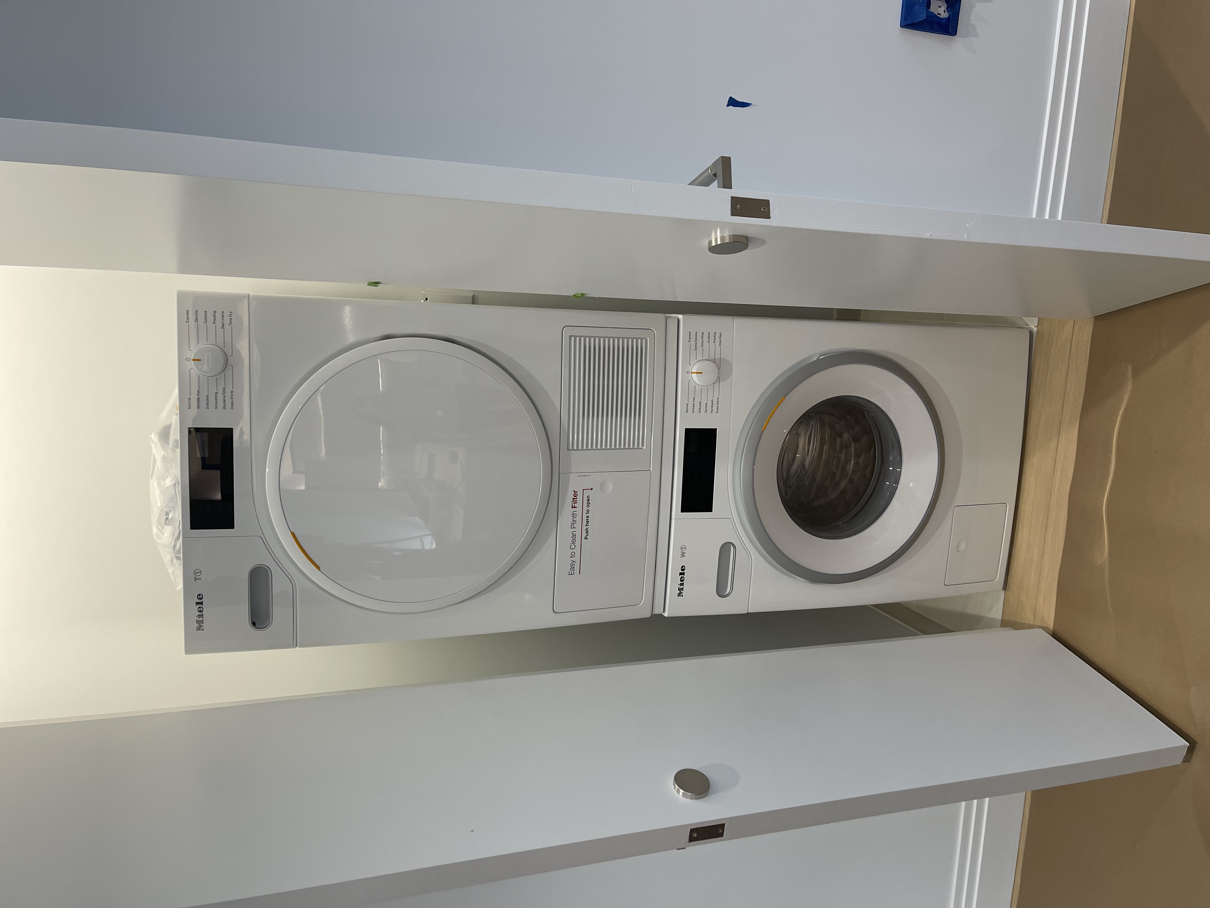 1 Wall Street, Unit 2512 Manhattan, NY 10005 - Photo 11 of 31 a utility room with dryer and washer