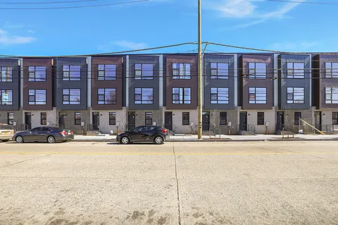 a front view of a building with street view