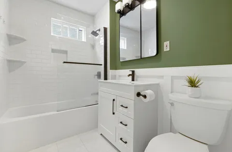 a bathroom with a bathtub and a sink