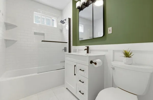 a bathroom with a bathtub and a sink