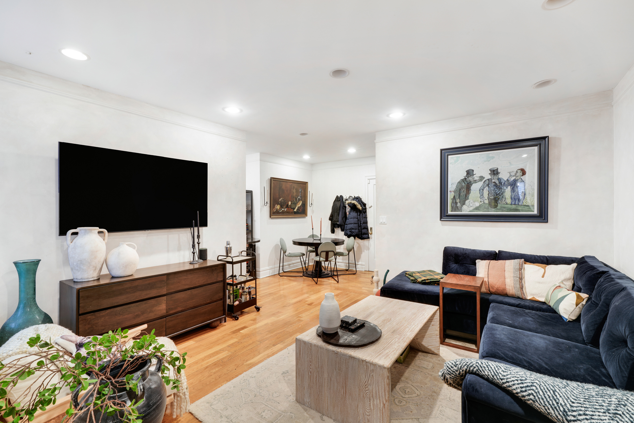 812 Riverside Drive, Unit 45 Manhattan, NY 10032 - Photo 2 of 9 a living room with furniture and a flat screen tv