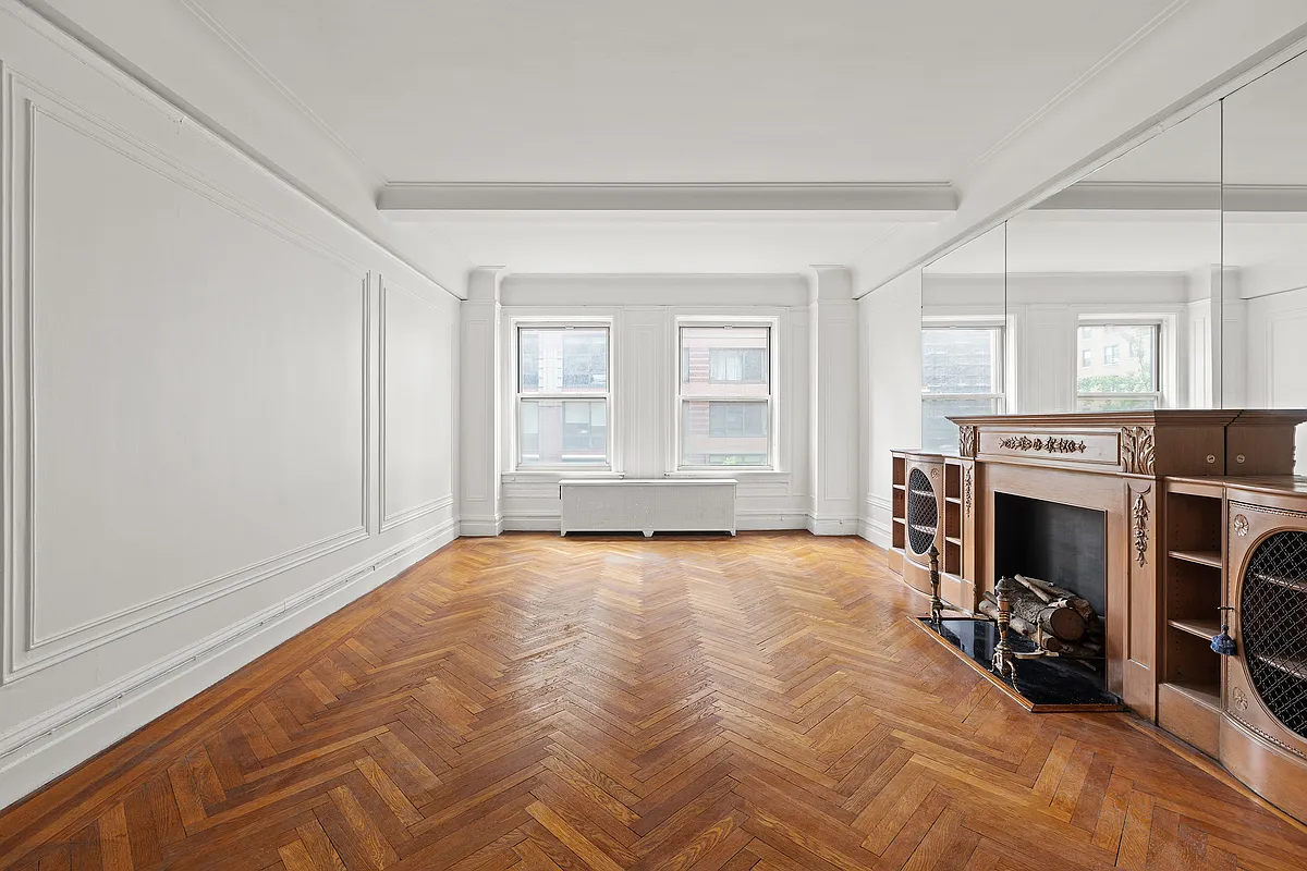 250 West 94th Street, Unit 5D Manhattan, NY 10025 - Photo 3 of 17 a view of an empty room with a fireplace and a window