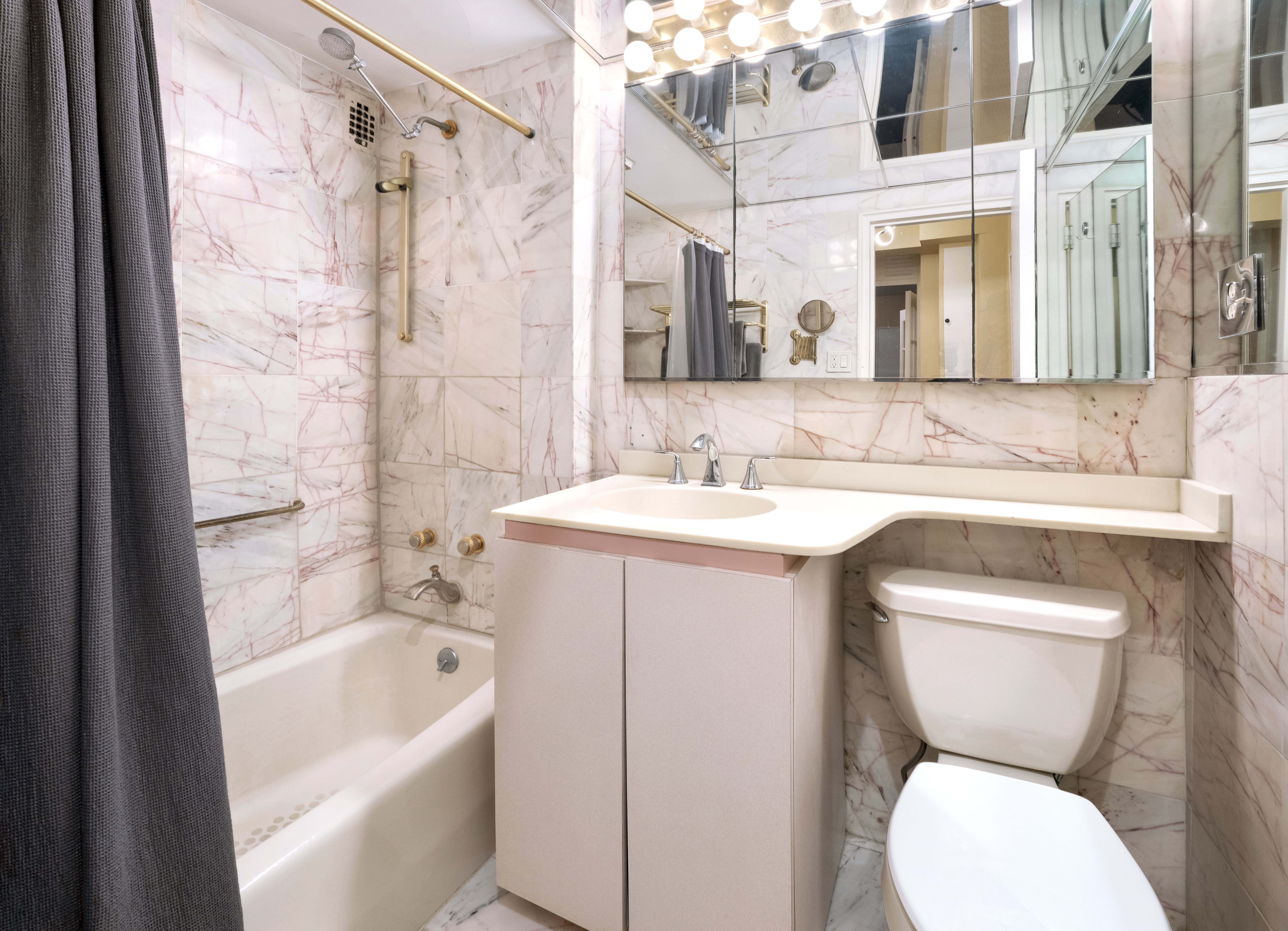 36 Sutton Place South, Unit 13D Manhattan, NY 10022 - Photo 8 of 9 a bathroom with a sink toilet and shower