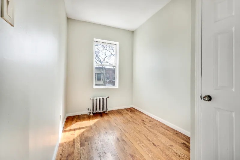 255 Covert Street Brooklyn, NY 11207 - Photo 9 of 18 a view of empty room with wooden floor