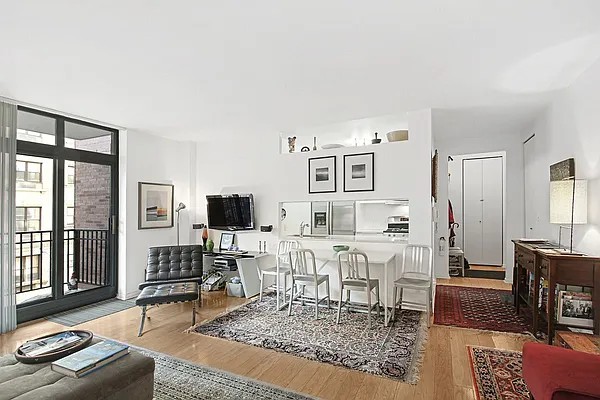 222 Riverside Drive, Unit 5D Manhattan, NY 10025 - Photo 2 of 8 a living room with furniture and a flat screen tv