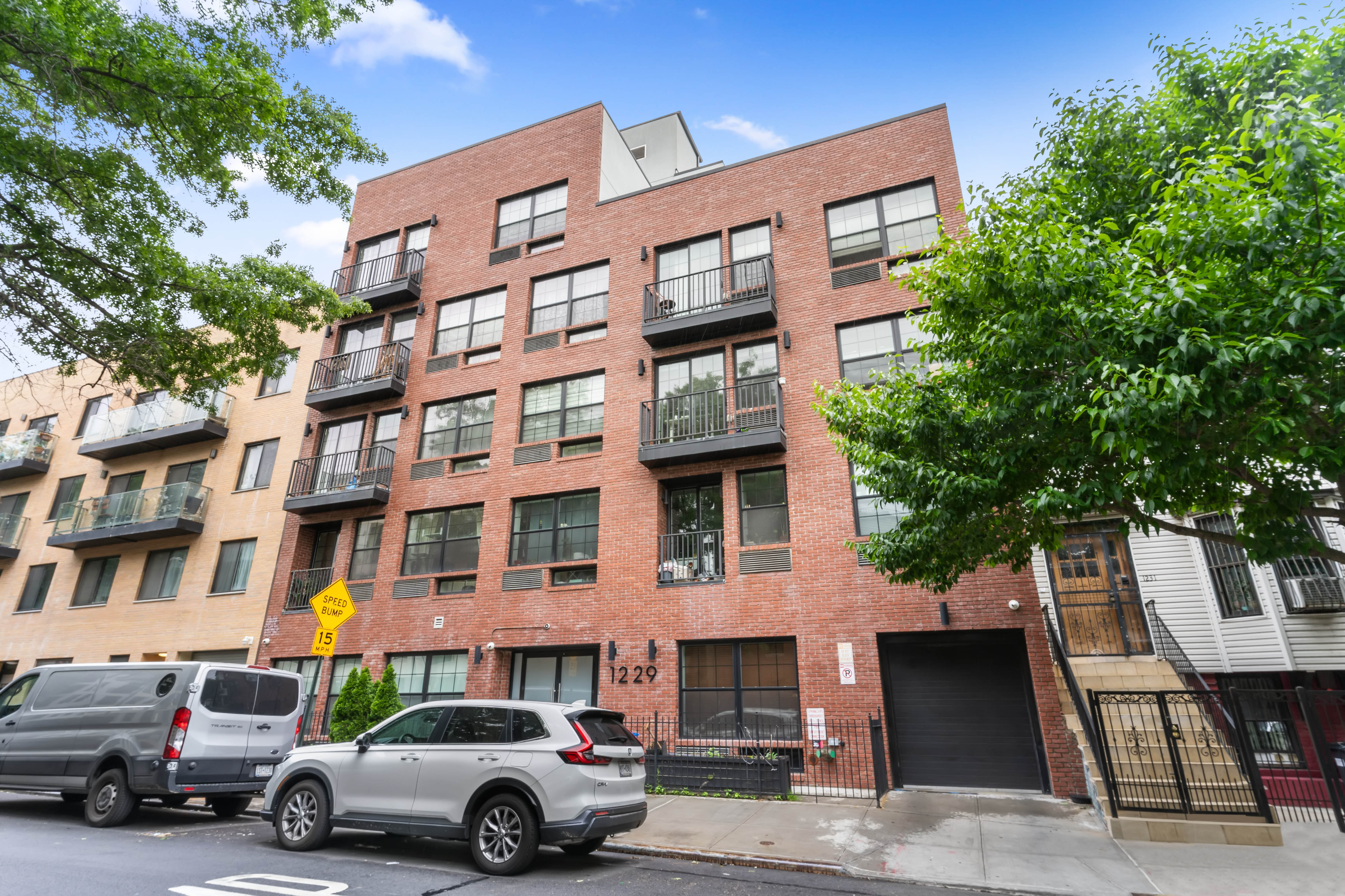 1229 Putnam Avenue, Unit 2A Brooklyn, NY 11221 - Photo 9 of 10 a car parked in front of a building