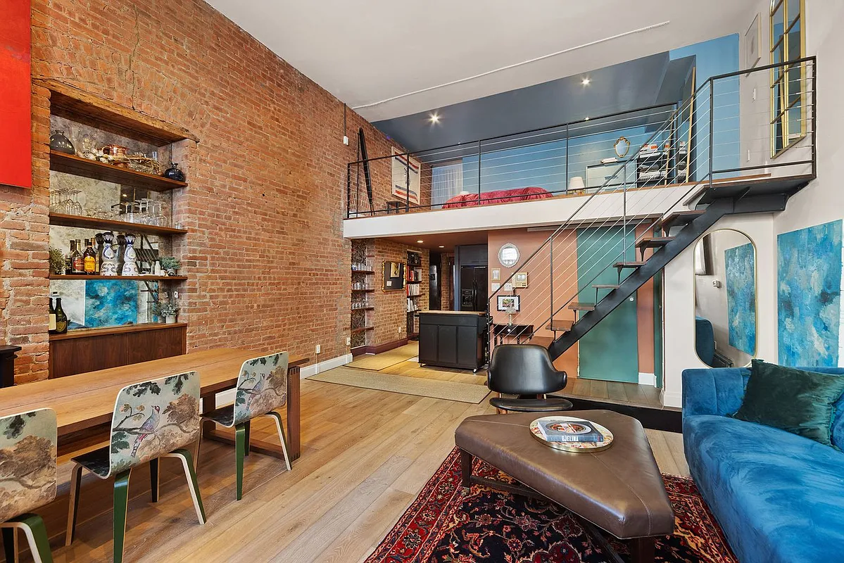 300 East 4th Street, Unit 1A Manhattan, NY 10009 - Photo 2 of 10 a view of a chairs and table on the wooden floor