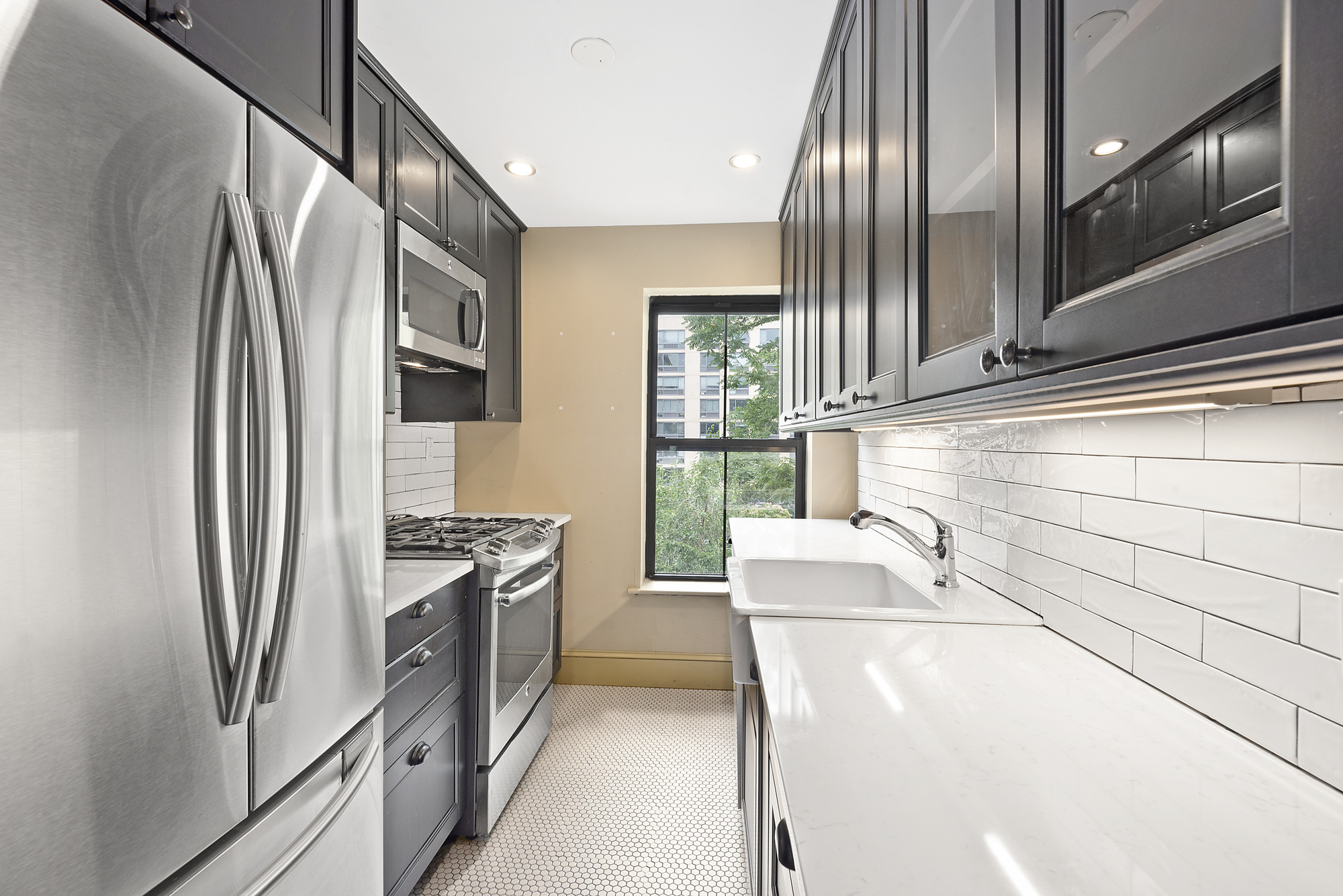 41 Duffield Street, Unit 3 Brooklyn, NY 11201 - Photo 3 of 7 a kitchen with stainless steel appliances granite countertop a refrigerator and a stove