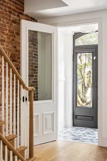 a view of an entryway with a door