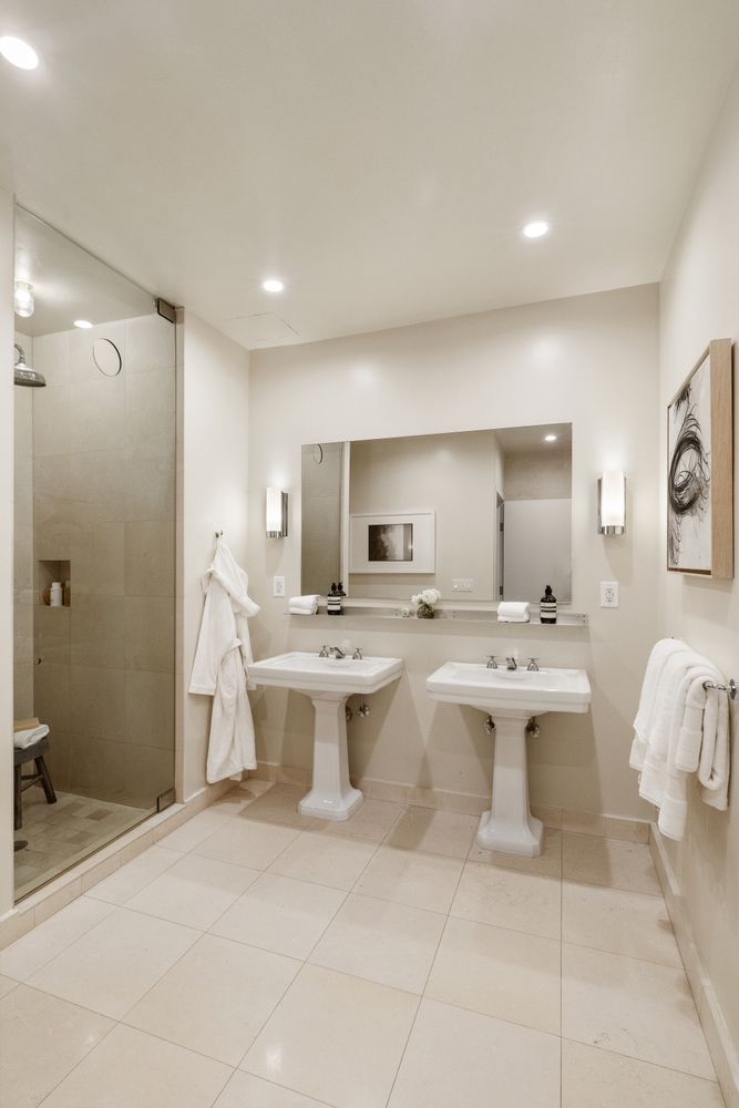 a view of a bathroom with a sink and mirror