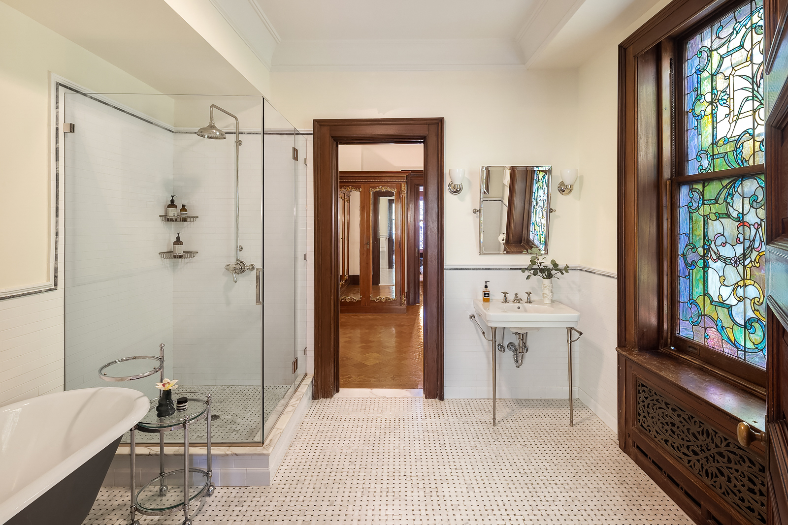 18 Prospect Park West Brooklyn, NY 11215 - Photo 19 of 40 a bathroom with a bathtub shower sink and mirror