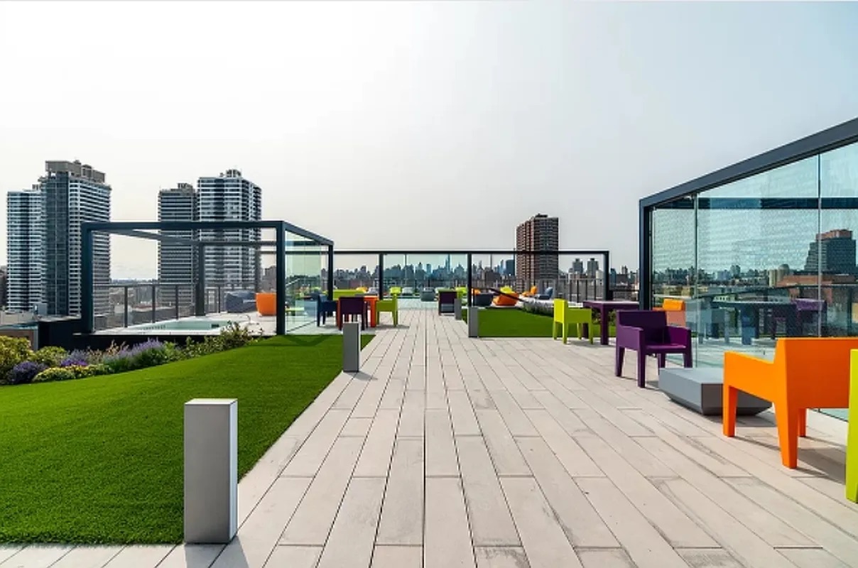 158 East 126th Street, Unit 730 Manhattan, NY 10035 - Photo 11 of 18 a park with water view and couches in the back