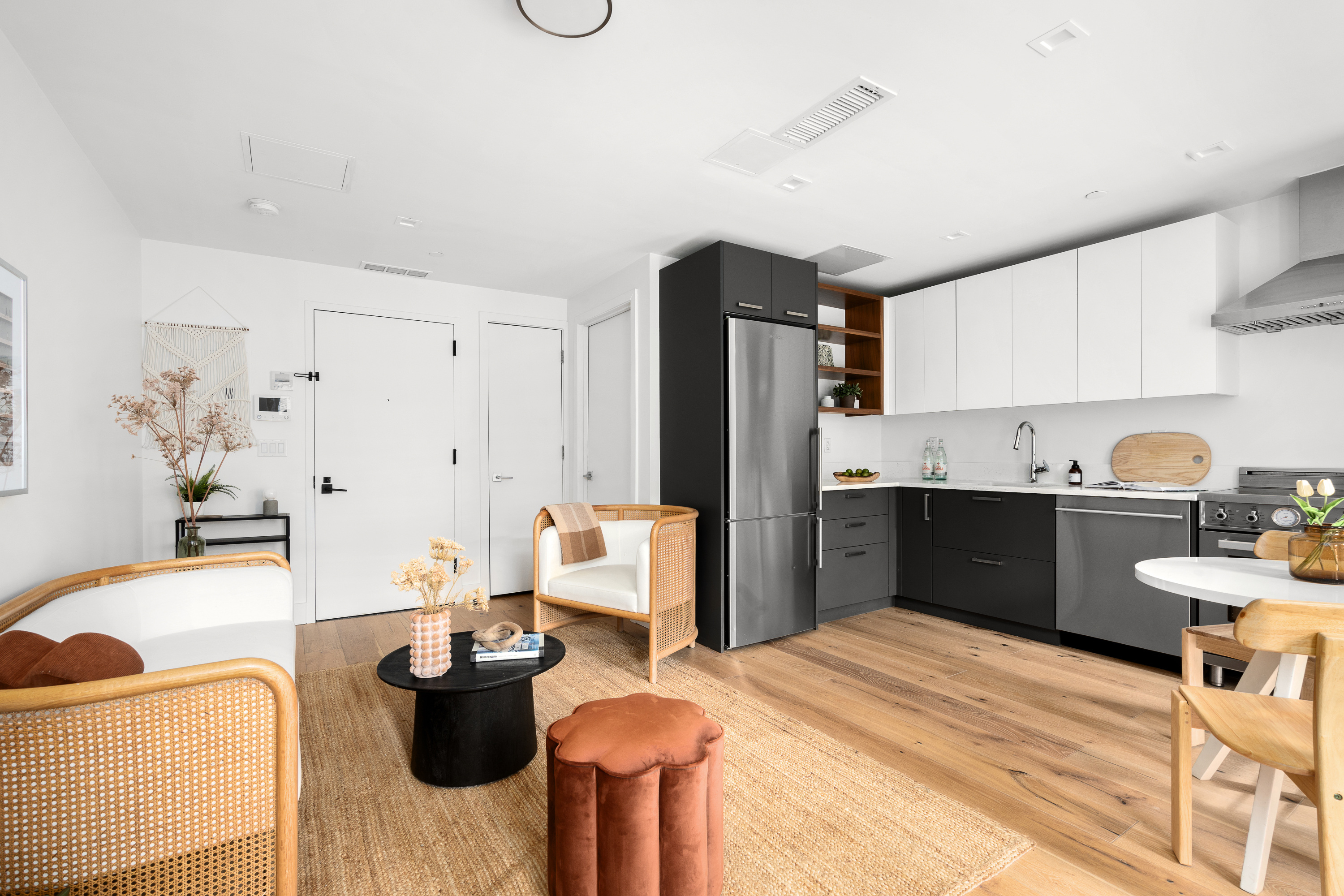 169 Eagle Street, Unit 1A Brooklyn, NY 11222 - Photo 3 of 9 a kitchen with stainless steel appliances kitchen island granite countertop a refrigerator and a sink