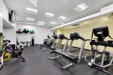 a view of a room with gym equipment