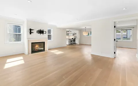 a kitchen with a center island and stainless steel appliances