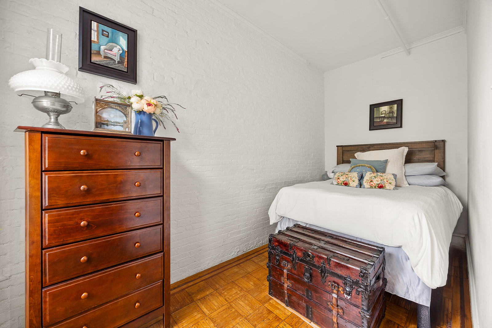 206 Lincoln Place, Unit 7 Brooklyn, NY 11217 - Photo 5 of 9 a bedroom with a bed and a dresser in it
