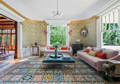 a living room with patio furniture and a window