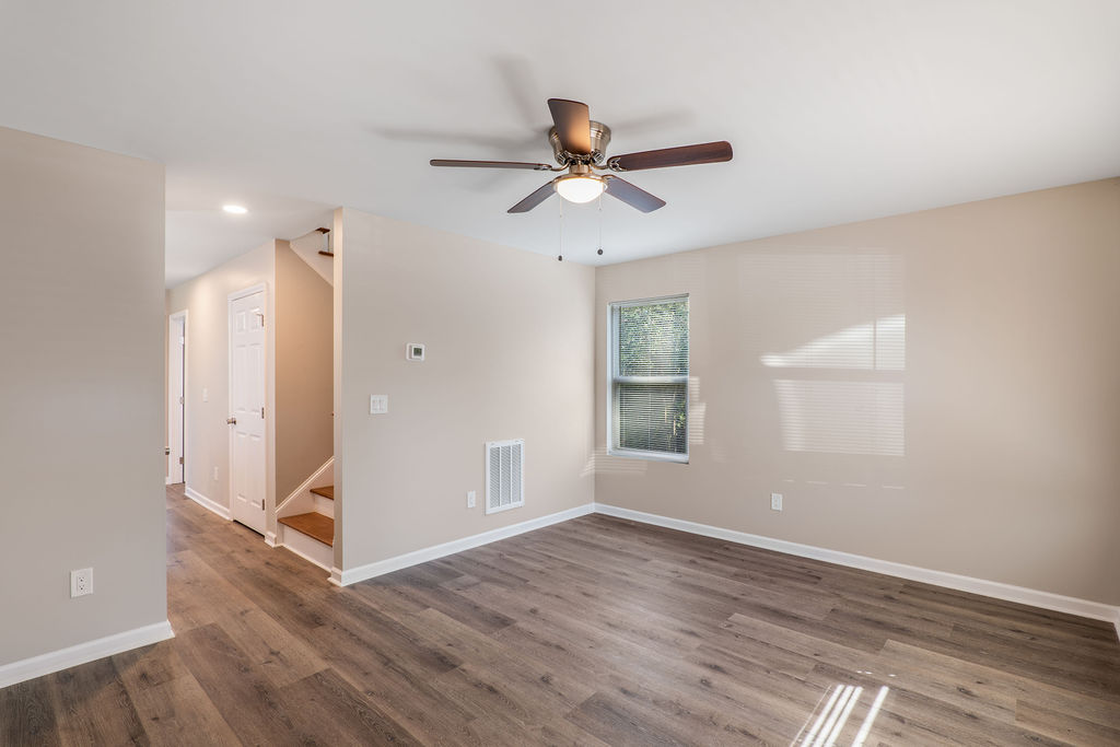 320 Adams Avenue Batesburg, SC 29006 - Photo 7 of 28 wooden floor in an empty room with a window