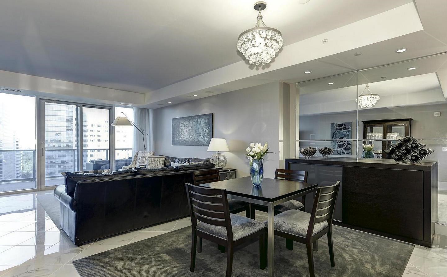 1881 North Nash Street, Unit 1009 Arlington, VA 22209 - Photo 6 of 36 a dining room with wooden floor and chandelier