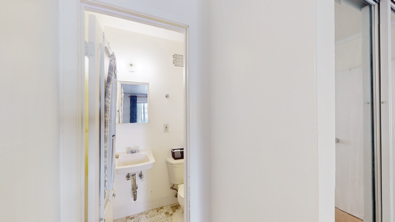 495 Central Avenue, Unit 2 Brooklyn, NY 11221 - Photo 9 of 19 a bathroom with a sink and a toilet