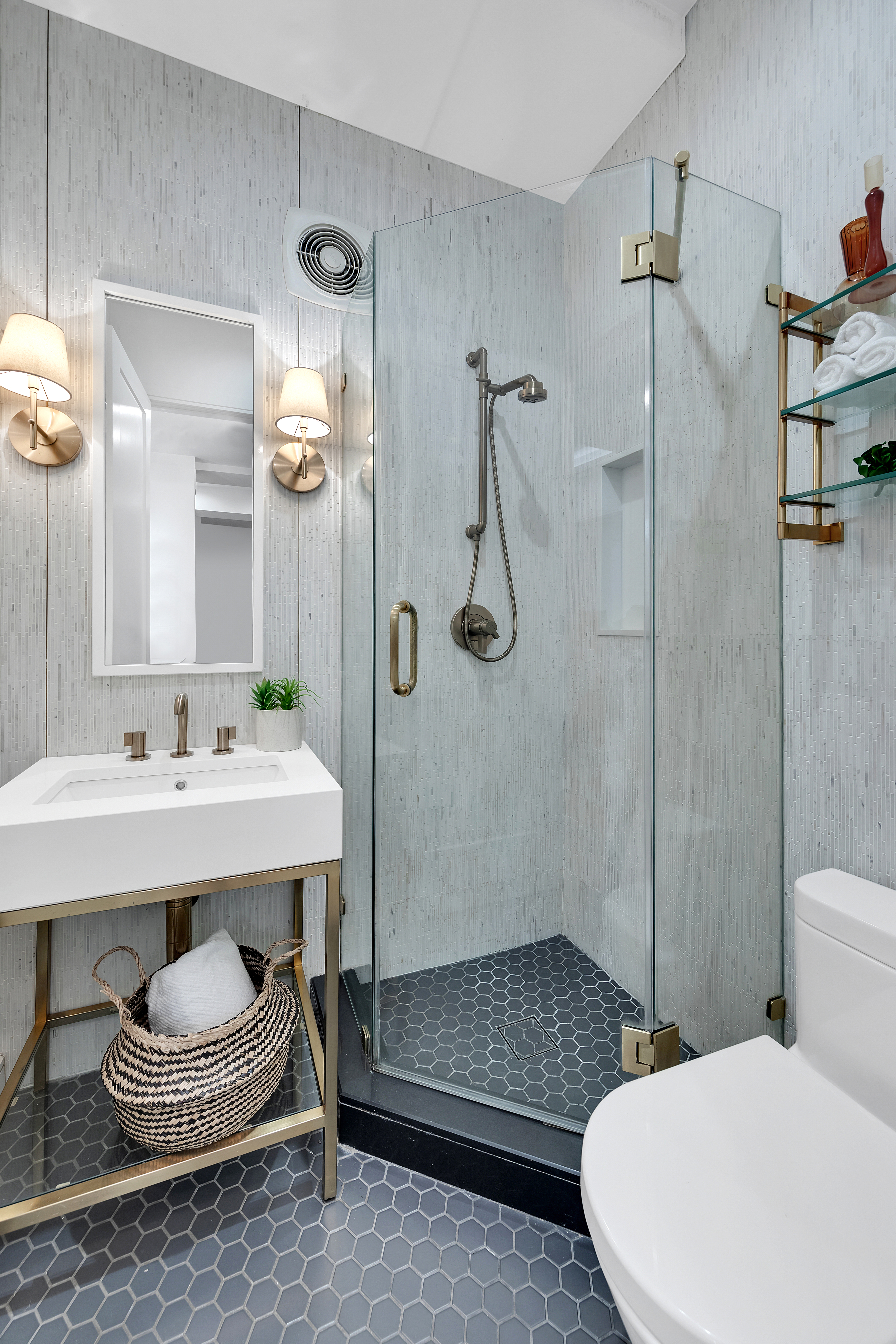 106 Central Park South, Unit 2B Manhattan, NY 10019 - Photo 7 of 12 a bathroom with a sink a toilet and shower