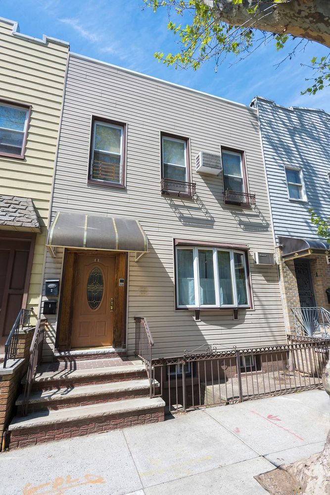239 Withers Street Brooklyn, NY 11211 - Photo 13 of 14 a view of a house with a backyard