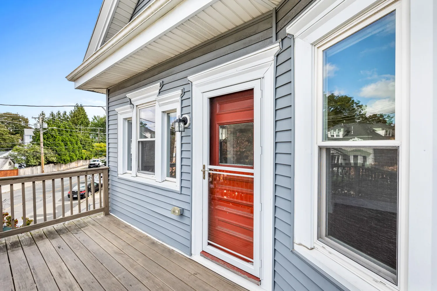 a view of a brick house with a large window