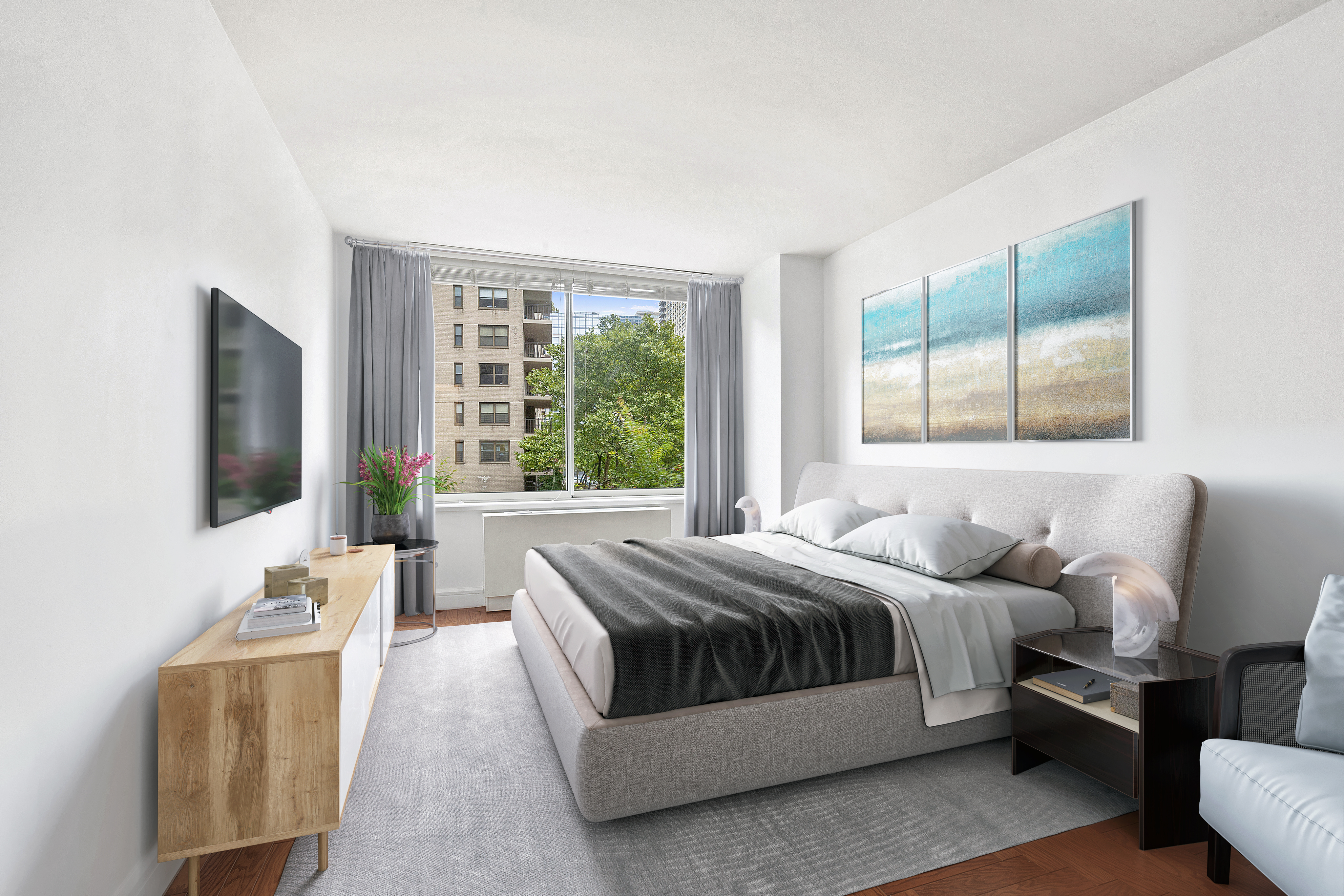 200 Riverside Boulevard, Unit 308 Manhattan, NY 10069 - Photo 2 of 6 a bedroom with a bed and a flat screen tv