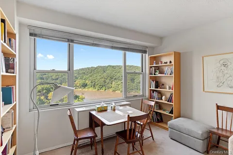 a view of a dining room with furniture window and outside view