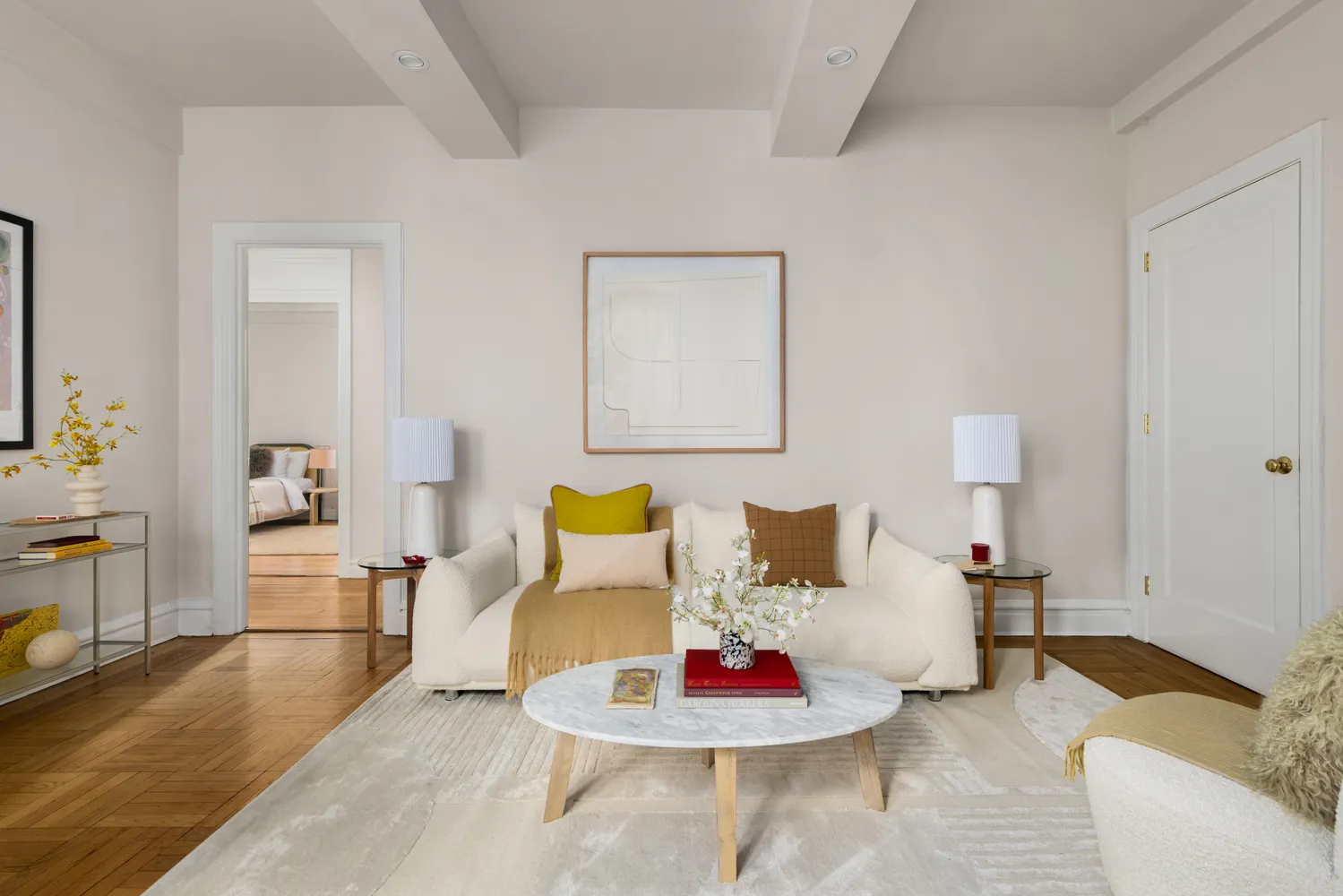 a living room with furniture and wooden floor