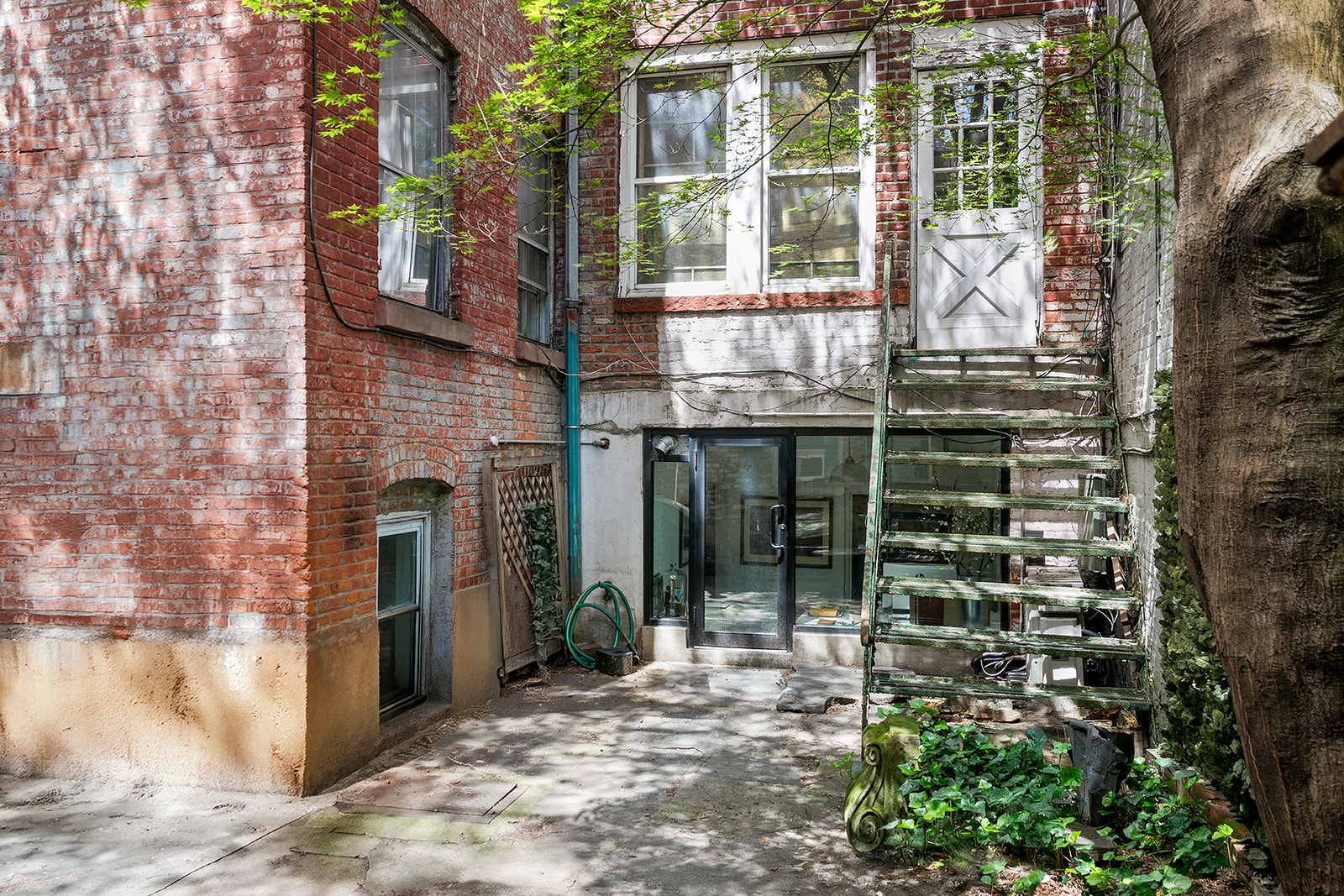 198 6th Avenue Manhattan, NY 10013 - Photo 33 of 45 a view of a brick house with a large windows