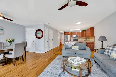 a living room with furniture and a table