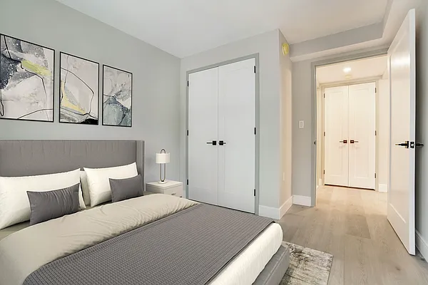 605 Hart Street, Unit 606 Brooklyn, NY 11221 - Photo 3 of 10 a bedroom with a bed and closet