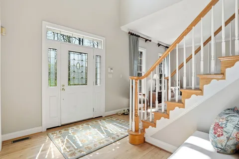 a kitchen with stainless steel appliances kitchen island granite countertop a refrigerator and microwave