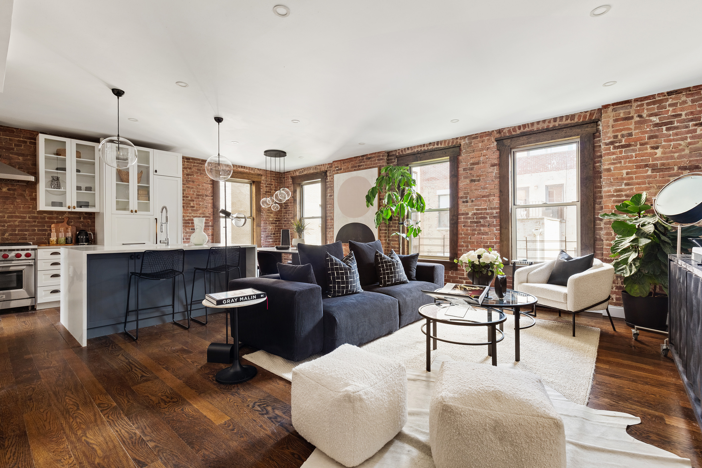 311 West 97th Street, Unit 5N Manhattan, NY 10025 - Photo 1 of 16 a living room with furniture and a large window