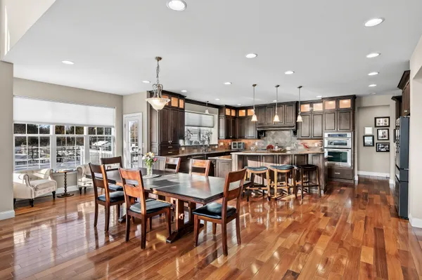 a view of a dining room with furniture window and wooden floor